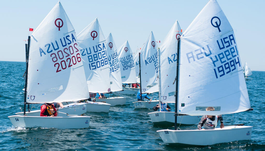 Junior sailors racing dinghies on Lake Macatawa