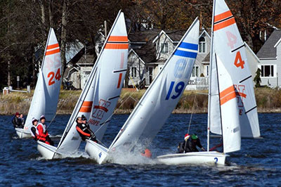 An MBJA coach working with sailors from a coach boat